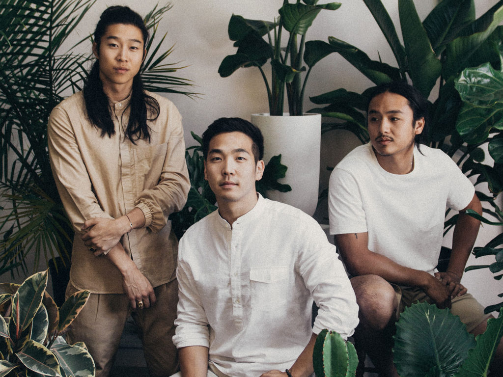 Rooted NYC owners wearing outfits from ONS Clothing