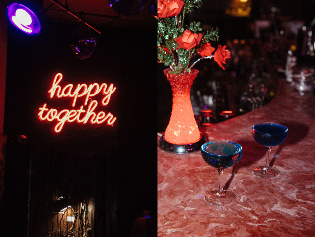 neon happy together sign and blue drinks on pink marble bar mood ring brooklyn