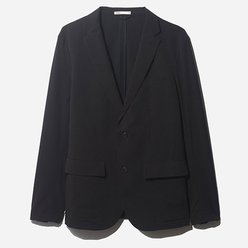 Braxton Cook wears the O.N.S clothing Conduit Packable Blazer